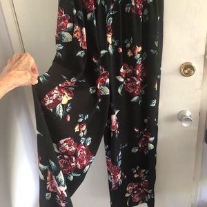 Wonderful jumpsuit, black floral  with button down front and pockets